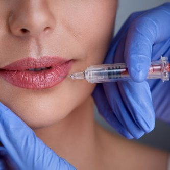 hands-of-expert-injecting-botox-PZX72PN hands-of-expert-injecting-botox-PZX72PN